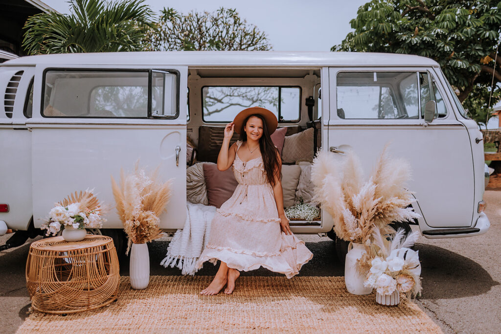 female business owner sits for branded photo in a vintage van 